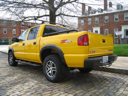 Viewed from the rear with wheels out of the shadows of the wheel wells.